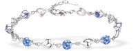 Adjustable Bracelet, Rhodium Plated
Turquoise crystals with Wild Hearts

6cm in diameter
Nickel Free, Hypoallergenic
Delivered in a soft, black, velveteen pouch