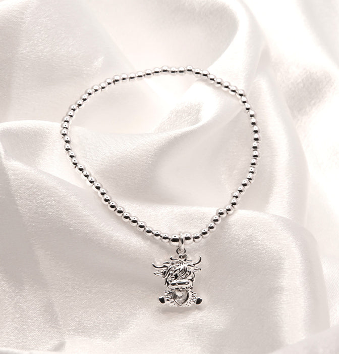HC52 - Stretch Charm Bracelet with Silver Coloured Beads and Bonnie Highland Cow Charm