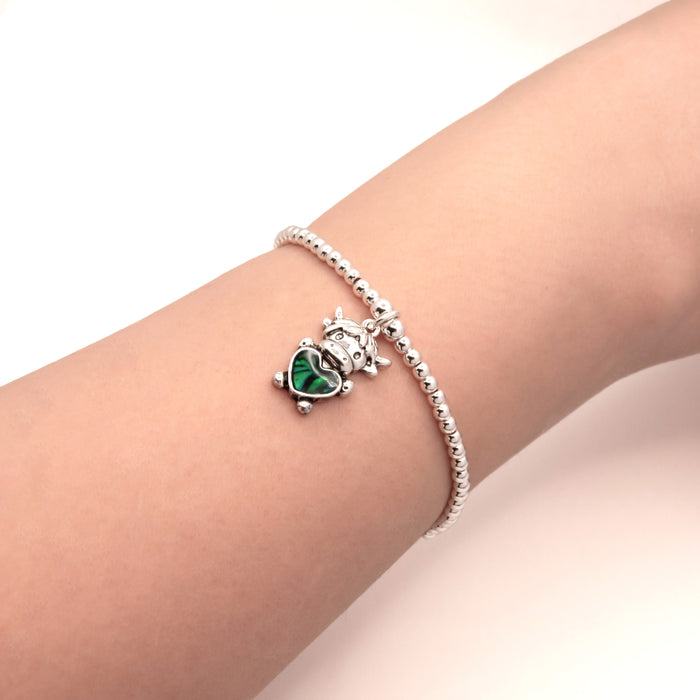 HC55 - Stretch Charm Bracelet with Silver Coloured Beads and Bessie Highland Cow Charm