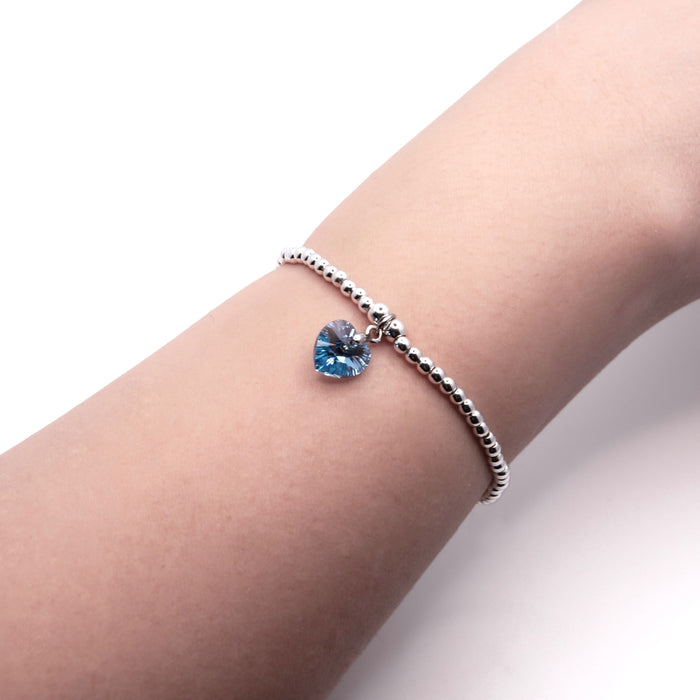 BR16 - Charm Bracelet with Crystal Heart Charm Embellished with Crystals by Swarovski® in Aquamarine Blue, Rhodium Plated