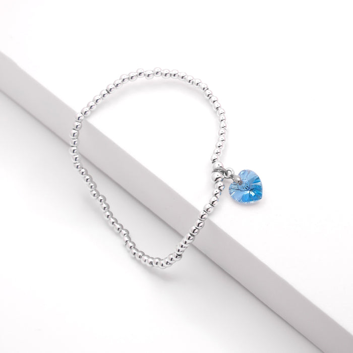 BR16 - Charm Bracelet with Crystal Heart Charm Embellished with Crystals by Swarovski® in Aquamarine Blue, Rhodium Plated