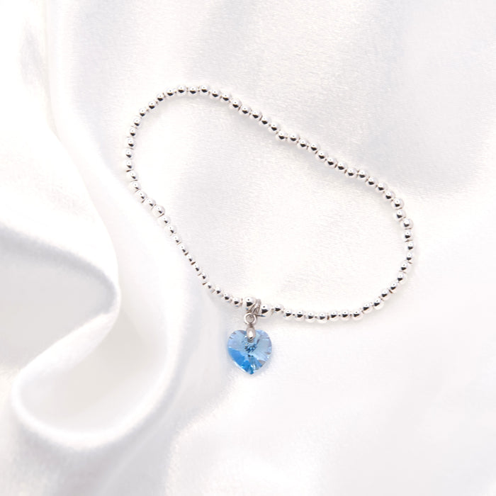 BR16 - Charm Bracelet with Crystal Heart Charm Embellished with Crystals by Swarovski® in Aquamarine Blue, Rhodium Plated