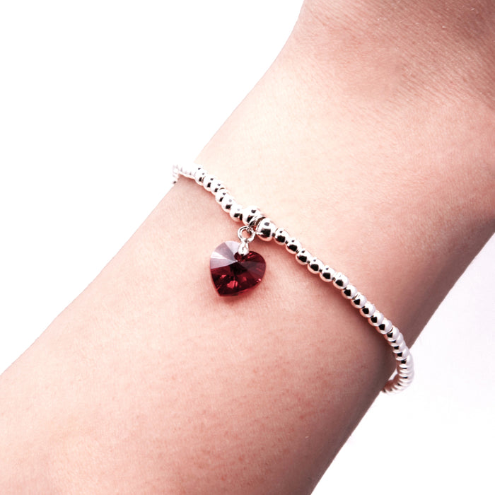 BR17 - Charm Bracelet with Crystal Heart Charm Embellished with Crystals by Swarovski® in Siam Red, Rhodium Plated