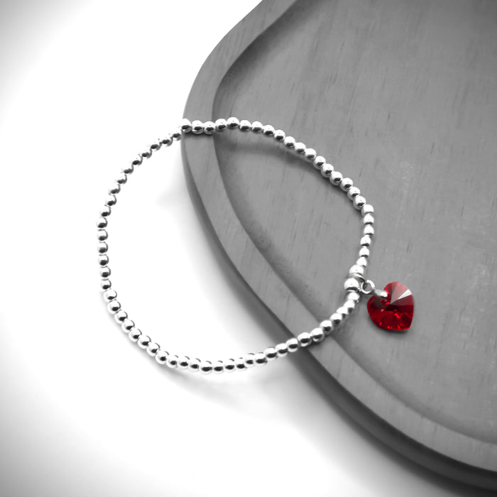 BR17 - Charm Bracelet with Crystal Heart Charm Embellished with Crystals by Swarovski® in Siam Red, Rhodium Plated