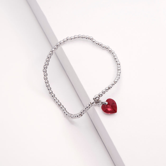 BR17 - Charm Bracelet with Crystal Heart Charm Embellished with Crystals by Swarovski® in Siam Red, Rhodium Plated
