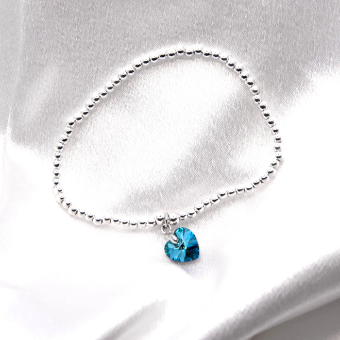 BR18 - Charm Bracelet with Crystal Heart Charm Embellished with Crystals by Swarovski® in Bermuda Blue, Rhodium Plated