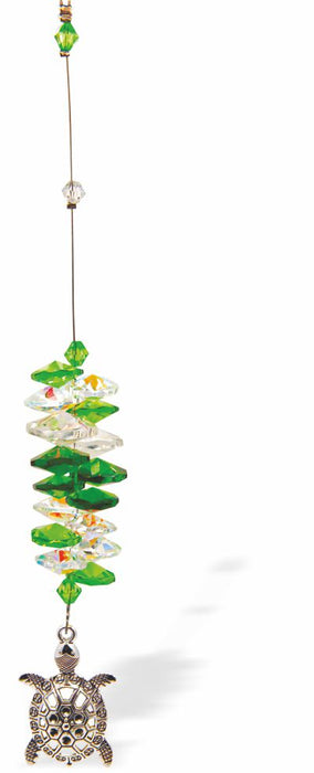 Austrian Crystal Suncatcher, Multi -faceted
Turtle Drop Feature
Greens and clear crystals
Delivered in a soft, black, velveteen pouch