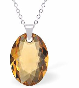 Austrian Crystal Multi Faceted Oval Elliptic Necklace Golden Topaz in Colour 16mm in size Choice of 18" Stainless Steel or Sterling Silver Chain Hypo allergenic: Free from Lead, Nickel and Cadmium See matching earrings EL77